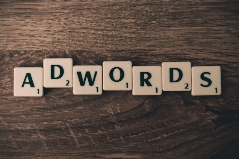 scrabble forming adwords on brown wooden surface 267401 768x510